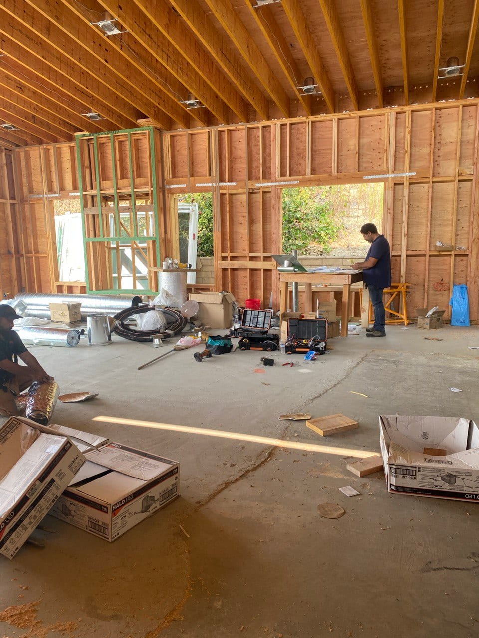 Close-in stage with crew working out the rough openings.